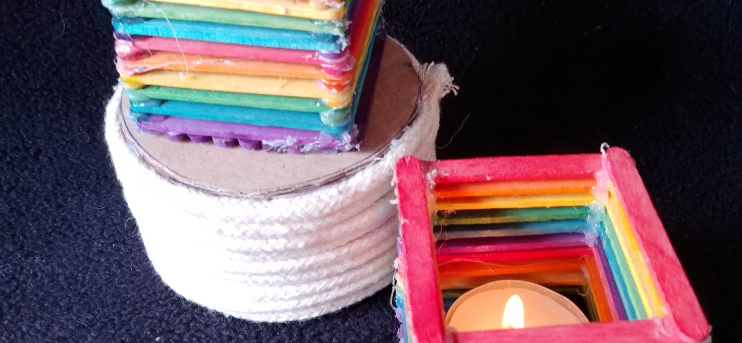 Popsicle stick candle holders.